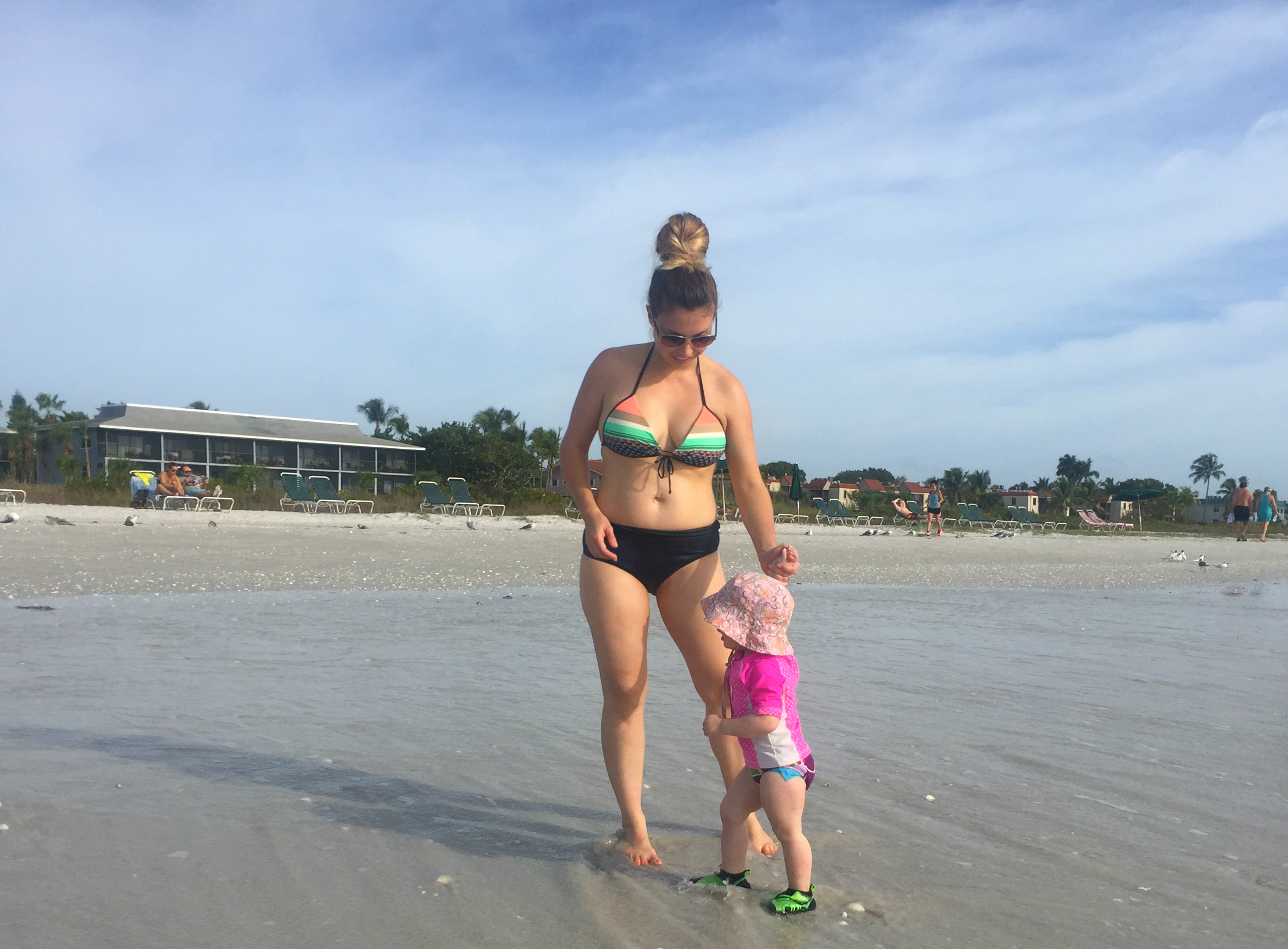 With toddler on beach