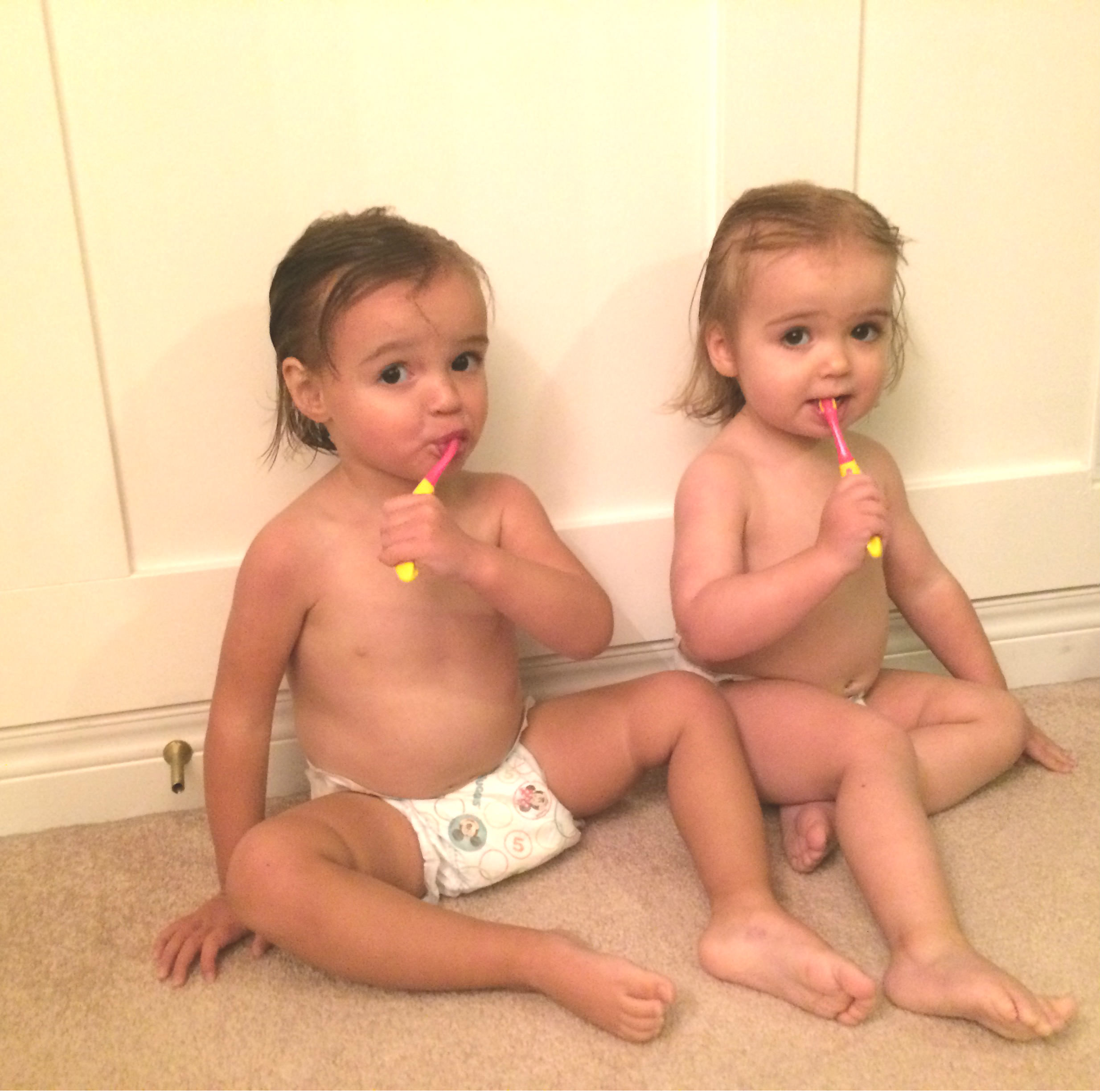 twins brushing teeth
