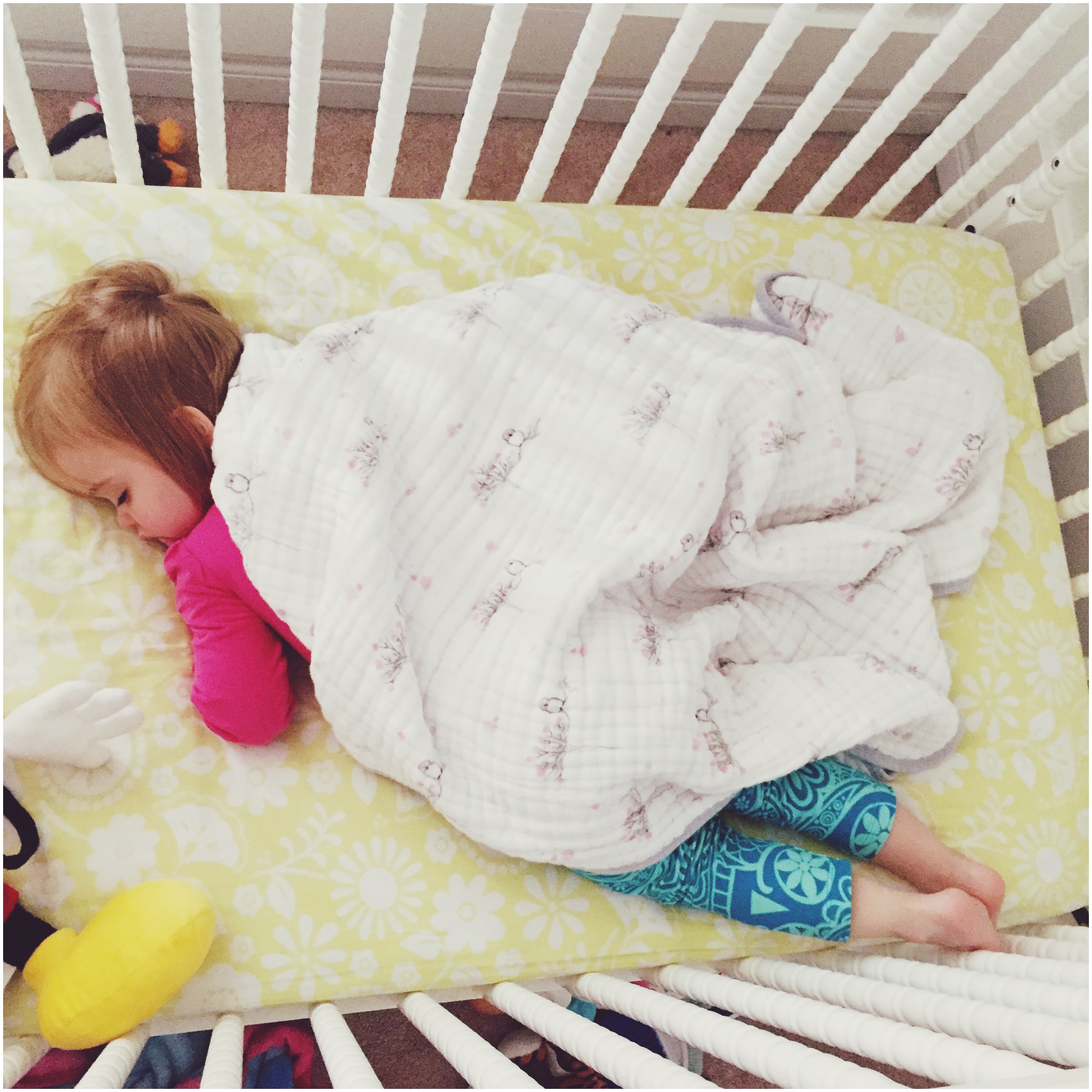 Mia sleeping in crib